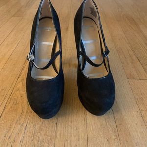 Black suede closed toe pumps